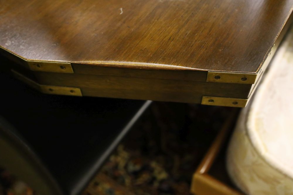 A military style mahogany and brass bound twin pillar dining table, width 182cm extended (one spare leaf) and six brown leather chairs